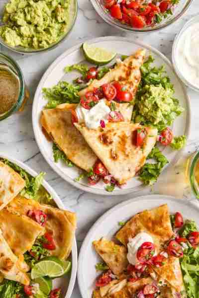 Easy Chicken Quesadillas - The best cheesy quesadillas! Golden brown crispy on the outside, perfectl...