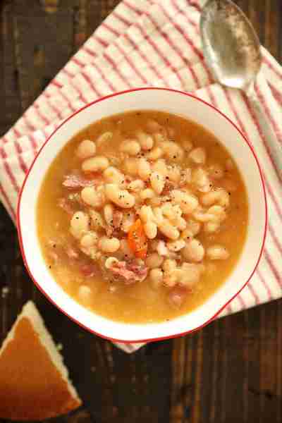 This recipe for Slow Cooker Ham and Beans is cooked low and slow with onions, celery, carrots, and h...