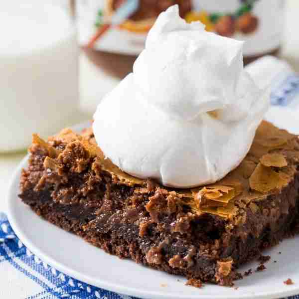 Nutella Gooey Butter Cake is made with a Devil’s Food Cake mix topped with a gooey cream cheese laye...