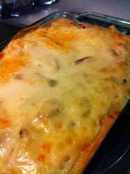 Mexican Chicken Casserole Ingredients: 1/2 onion sliced 1 can diced green chilis 1.5 lb frozen, slic...