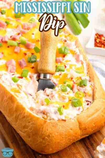 French bread stuffed with warm, creamy Mississippi Sin Dip topped with melted cheese, green onions,...