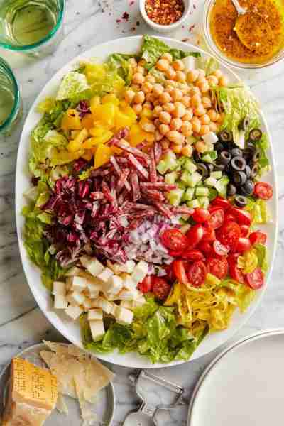 Italian Chopped Salad - Crisp lettuce, cubed mozzarella, and diced salami in a red wine vinaigrette....