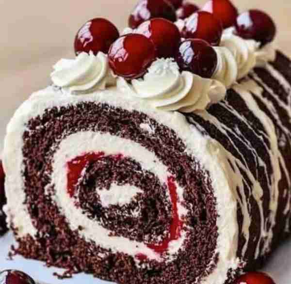 🍒🌲 Black Forest Cream Roll Cake Fluffy chocolate sponge, cherry filling, and clouds of whipped cre...