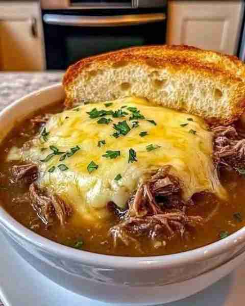 French Onion Beef Soup A rich and savory soup combining tender beef, caramelized onions, and a melte...