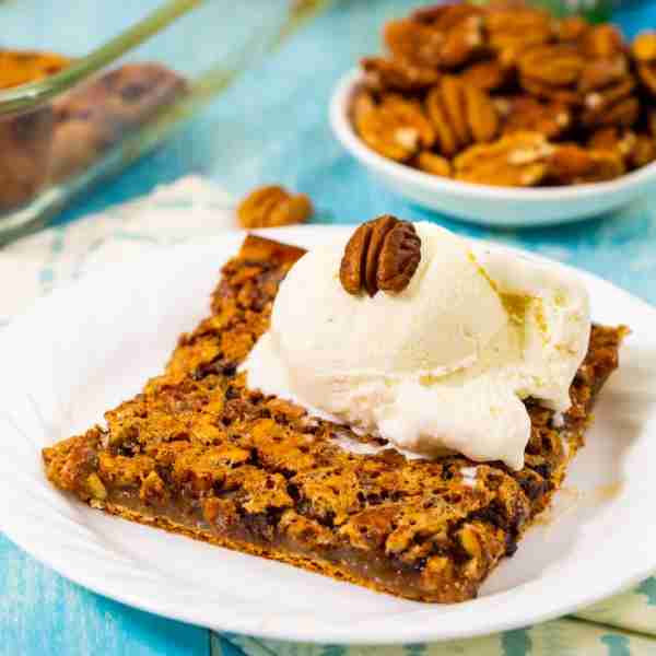 Crescent Pecan Pie Bars- a sugary, crunchy pecan filling with a few chocolate chips on top of a butt...