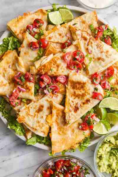 Easy Chicken Quesadillas - The best cheesy quesadillas! Golden brown crispy on the outside, perfectl...