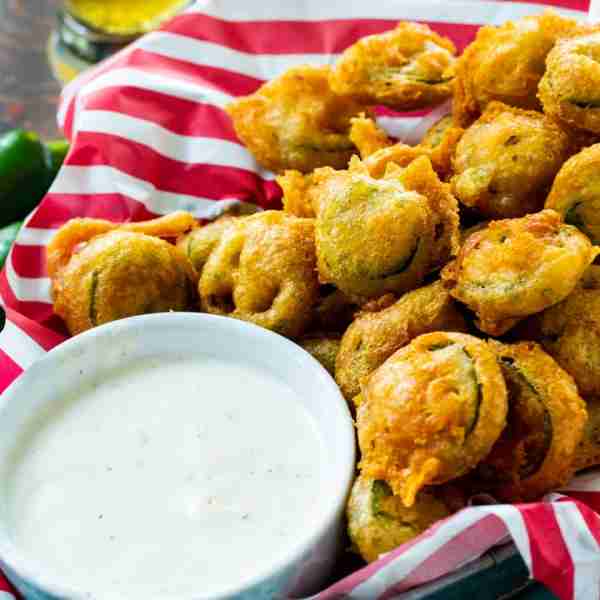 Deep Fried Jalapeno Slices, aka Bottle Caps, have a super crispy coating and really pack the heat. D...