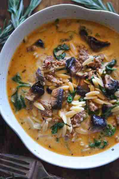 Italian Sausage Orzo Soup with Portobello Mushrooms, Spinach, fresh herbs, and a touch of cream! ⬇️...