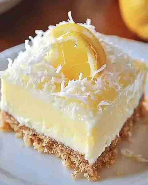No Bake Lemon Coconut Cheesecake Bars Ingredients 1 1/2 cups graham cracker crumbs 1/4 cup granulate...