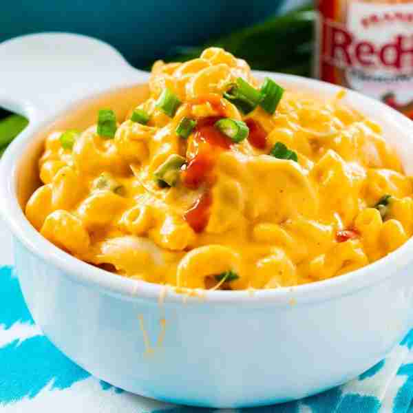 Buffalo Chicken Mac and Cheese is a stovetop mac and cheese that is super creamy and spicy. Shredded...