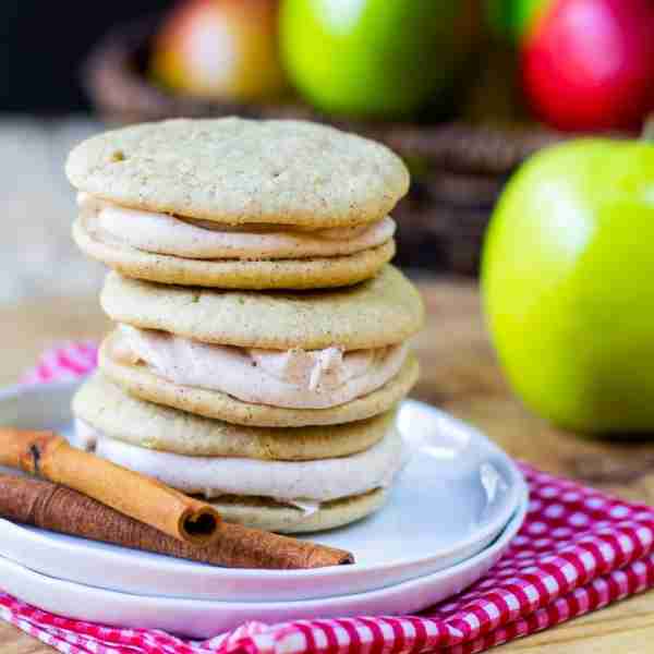 Apple Spice Whoopie Pies with two super soft and cakey cookies held together with a super sweet cinn...