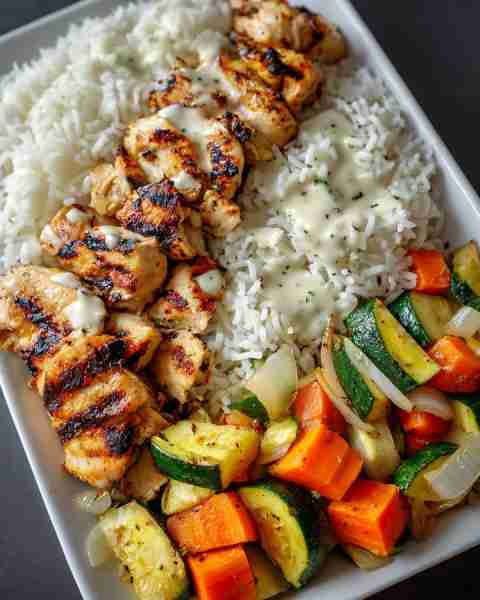 Grilled Chicken with Rice, Roasted Veggies & Creamy Garlic Sauce 🥕🥒 Prep Time: 20 minutes Cook Tim...