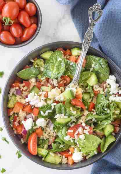Mediterranean Inspired Brown Rice Salad This bright and tangy Mediterranean-inspired brown rice sala...