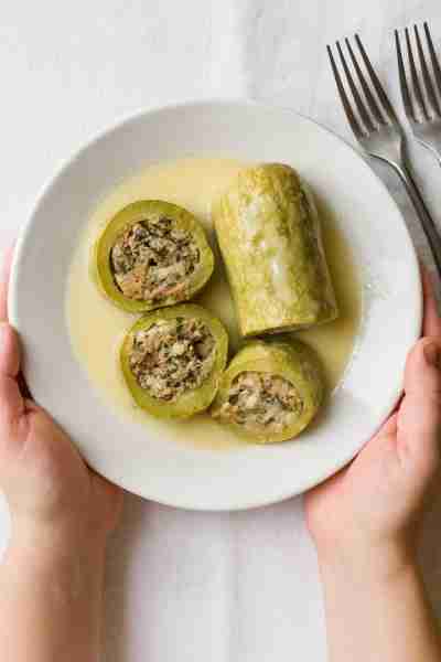 Greek Kolokithakia Gemista – tender zucchini stuffed with herbs, rice, and love. A taste of summer s...