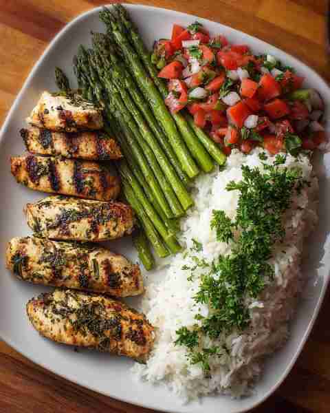 Herb-Grilled Chicken with Garlic Asparagus, Fluffy Rice & Fresh Tomato Salsa 🍅 Prep Time: 20 minute...