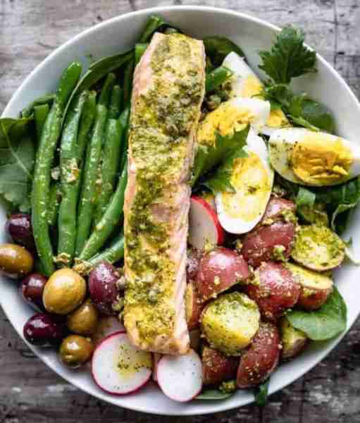 Salmon Niçoise Salmon Niçoise Salad made with salmon baked with pesto on top. Green beans, hard-boil...