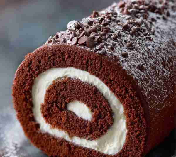 🍫 Chocolate Cream Roll Cake A soft cocoa sponge cake rolled with a light vanilla cream filling — si...