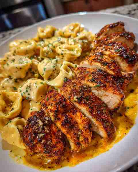 Spicy Cajun Chicken Tortellini in Garlic Velveeta Alfredo Cheese Sauce Ingredients: 1 pound chicken...