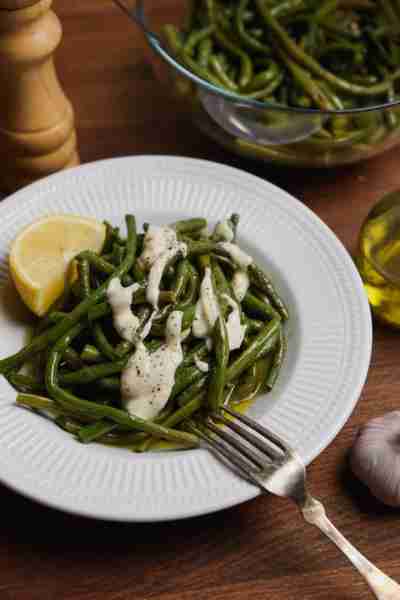 Fresh String Bean Salad served with Skordostoumpi. A rustic, creamy garlic sauce made with stale bre...