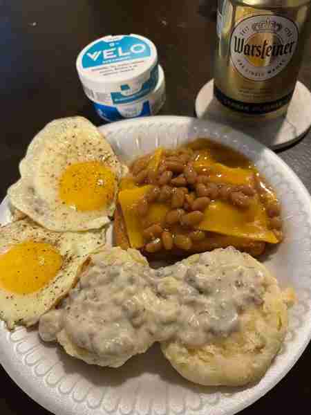 Cheesy beans on toast and biscuits with gravy. Fantastic breakfast plate by Jacob P