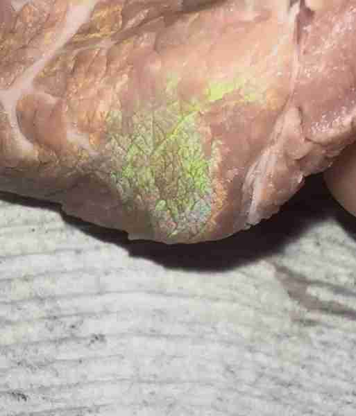 Help!! why is my steak from aldi shining every time light hits it like an opal or an oil spill?!?!?!...
