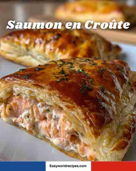 🥖🐟 Saumon en Croûte Salmon fillet wrapped in puff pastry with a creamy herb filling. Golden, flaky...