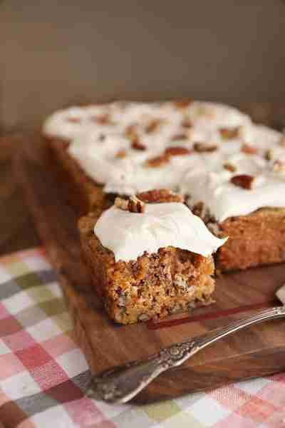 Moist, dense Sweet Potato Cake with Marshmallow Buttercream Frosting is a delicious twist on carrot...