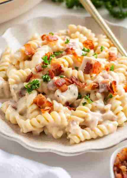 Chicken bacon ranch pasta dish is loaded with tender pasta, chicken, and bacon in a cheesy ranch fla...