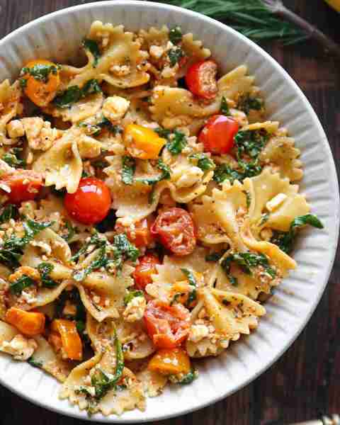Mediterranean Pasta with Feta Cheese, Spinach, Garlic, and Cherry Tomatoes. Recipe created by Julia'...