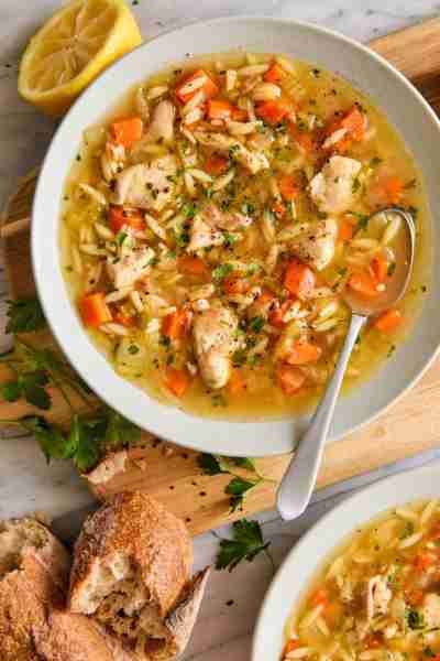 Lemon Chicken Orzo Soup - Chockfull of hearty veggies and tender chicken in a refreshing lemony brot...