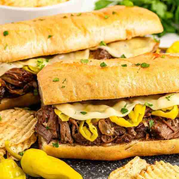Incredible Mississippi Pot Roast Sandwiches! 🥖 RECIPE BELOW! 🥖 Tender & Juicy Beef piled high on t...