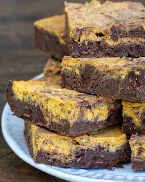 These Pumpkin Cheesecake Brownies are gooey, chocolatey and filled with fall flavor!