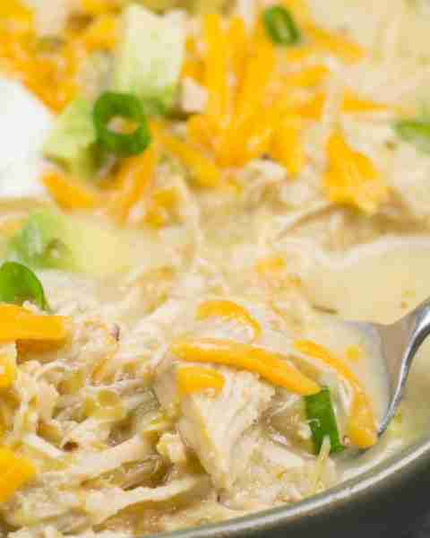 This Keto White Chicken Chili is loaded with shredded chicken, chilis, peppers and cauliflower rice!