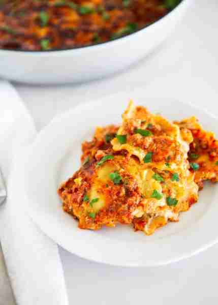Layers of cheese ravioli, savory sausage, marinara, and creamy ricotta bake into a million dollar ra...