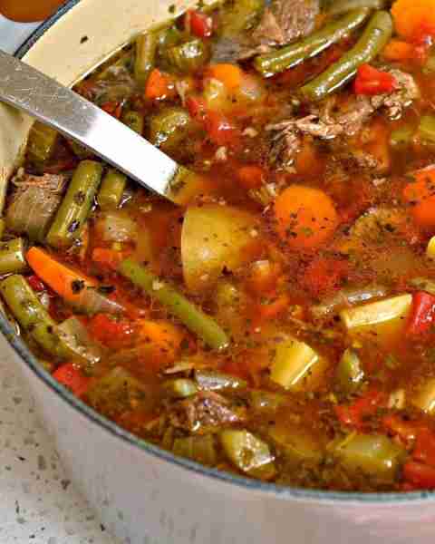 “Beef Vegetable Soup is made with tender chunks of slowly simmered chuck roast with onions, celery,...