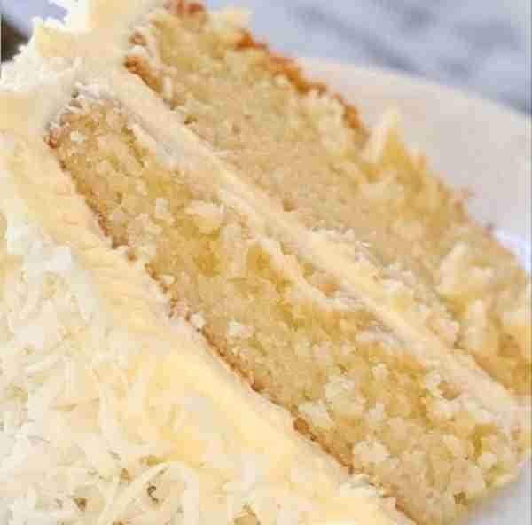 Coconut Cake is a rich and indulgent dessert that typically features three moist layers of coconut-f...