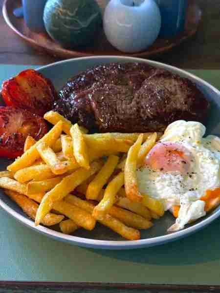 Ribeye steak, chips, egg & tomato. I did have a nice piece of crusty bread before the bread police s...
