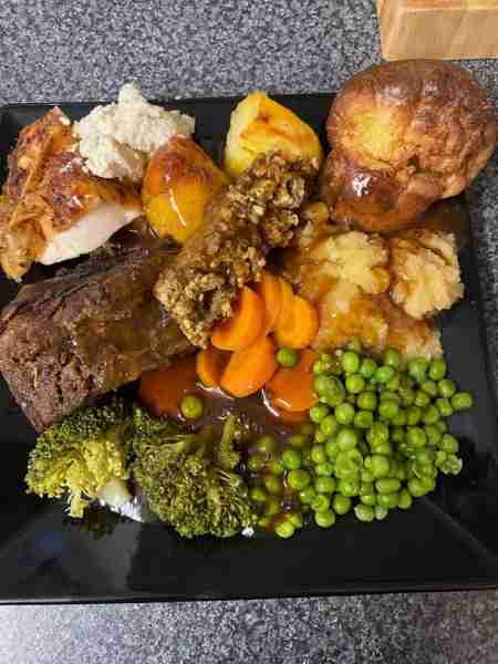 Seasoned Roast Chicken, Beef Short ribs, Garlic Roasties, veggies and homemade Yorkshire puddings wi...
