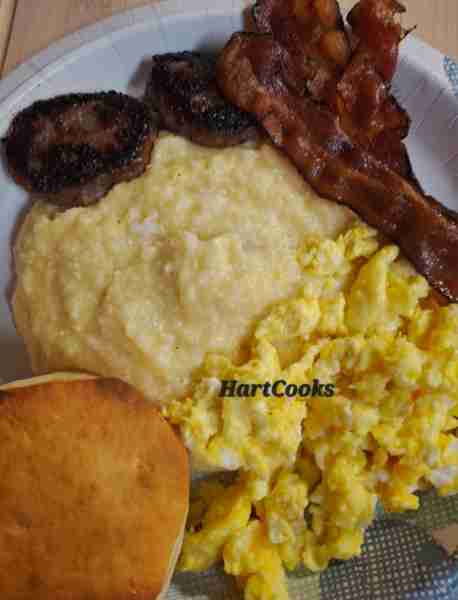 Cheesy Grits, Scrambled Eggs, Bacon, Maple Sausage Patties, and Biscuits 😋🍽