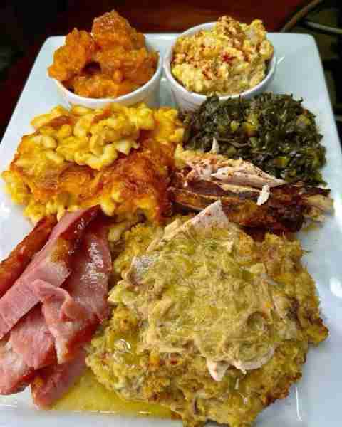 Southern comfort feast loaded with golden mac, tender ham, savory greens, and creamy casserole delig...