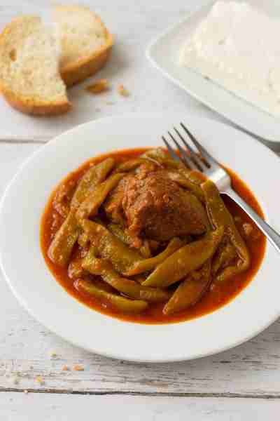 Mosharaki me Fasolakia – tender beef slowly cooked with fresh green beans, tomatoes, olive oil, and...