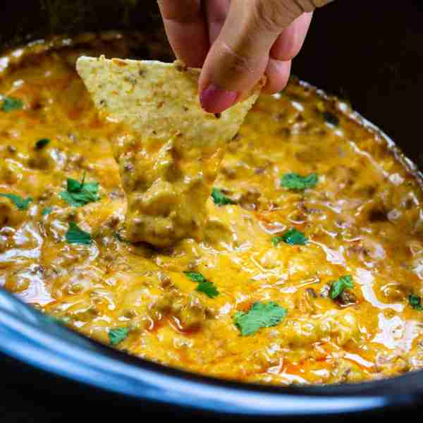 4-Ingredient Beef Enchilada Dip is an easy slow cooker dip that is positively addicting. Served with...