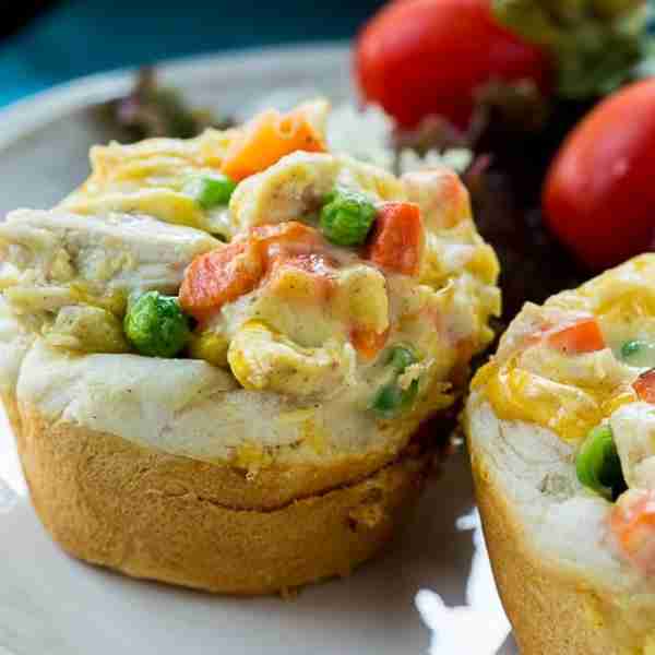 Mini Chicken Pot Pies consist of a quick and easy chicken pot pie filling in a buttery biscuit cup....