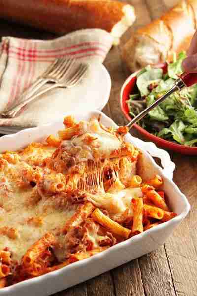Cheesy Baked Ziti is filled with delicious flavor, cheesy goodness, and simple and affordable ingred...
