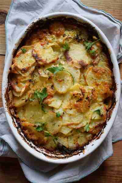 This Potato & Spinach Gratin is made using thinly sliced potatoes, layers of fresh spinach and toppe...