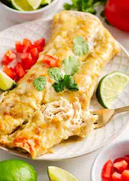 Cream cheese chicken enchiladas are a Mexican inspired dinner recipe with chicken, cream cheese, gre...