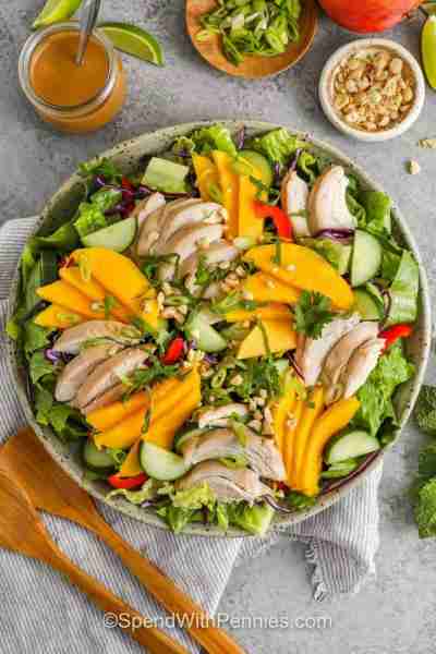 Comment RECIPE to get the recipe! This crisp, colorful salad features juicy mango, tender chicken, a...