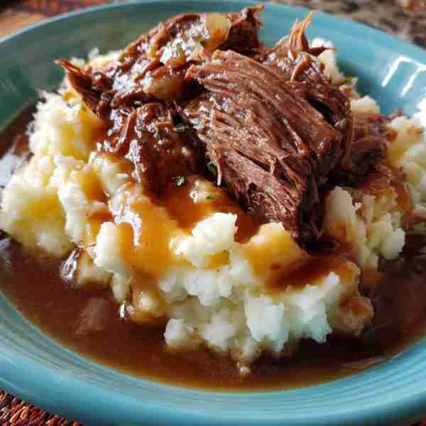 Roast and gravy over potatoes Ingredients 2 lb roast 1 pack au ju gravy mix 1 pack brown gravy mix...