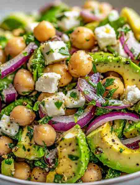 Fresh, vibrant, and oh-so-delicious, this Chickpea Feta Avocado Salad is your new go-to for a health...