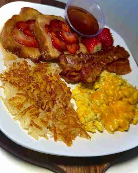 Buttery Strawberry Pound Pan Cakes (similar to French toast) & warm maple syrup w/ cheese eggs scram...